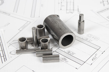 Mechanical engineering and metalworking. Metal parts rollers and bushings on engineering drawings...