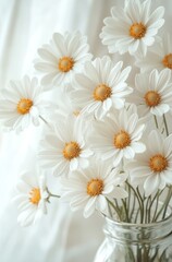 White daisies in a glass jar with soft light  
