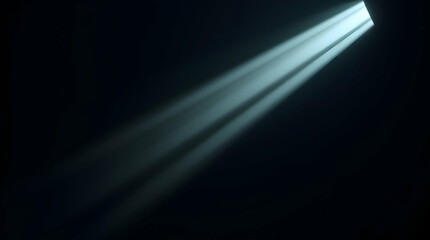 A beam of light shines diagonally from a small opening in the darkness, creating a dramatic and focused illumination.