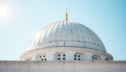 Obraz premium Modern mosque dome under bright sunlight, architectural beauty