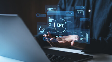 Businessman analyzing KPI on holographic interface.