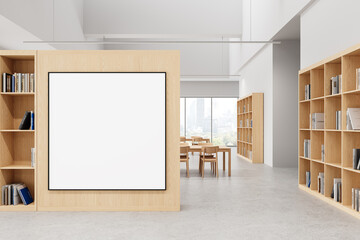 Modern library interior with blank poster on wooden wall. 3D Rendering