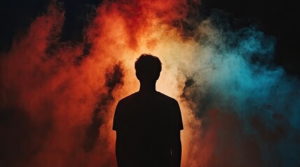 Man silhouetted in colorful smoke, mystery, concept