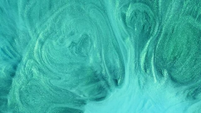 Abstract fluid art with green and turquoise tones interwoven with glitter highlights. Perfect for meditation visuals, branding projects, or elegant design elements.