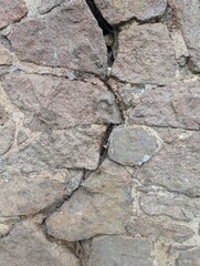 An very old stone wall.Moss.Texture 