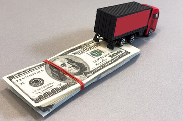 a toy truck is on the banknotes