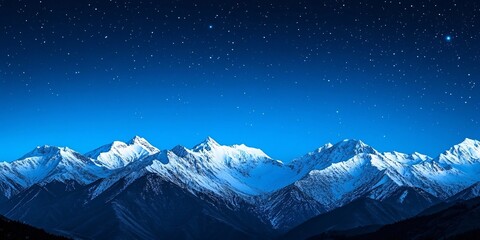 Snow-capped mountains under a star-filled night sky