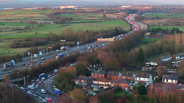 Aerial video of a traffic on M62 Motorway at Simister, Manchester