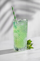 glass of green cocktail