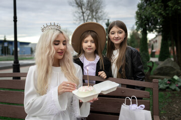 Portrait of a young beautiful mother and two young daughters.