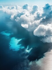 Naklejka premium Aerial view of fluffy clouds casting shadows over the clear blue sea in Puerto Madryn, Argentina , clouds, aerial view, sea