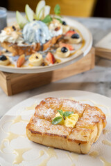 Savoring gourmet dessert indulgence a chic 's fluffy french toast spread in bright ambiance