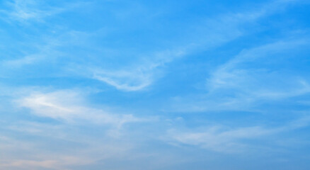 Fototapeta premium the sky is clear blue with fluffy white clouds, the sky is very bright, and the sun shines.