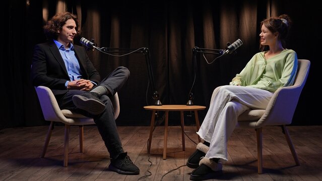 Engaging Podcast Interview Between Influencers in a Modern Studio Setting