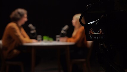 Engaging Conversation Unfolds in a Dynamic Podcast Recording Studio With Enthusiastic Hosts