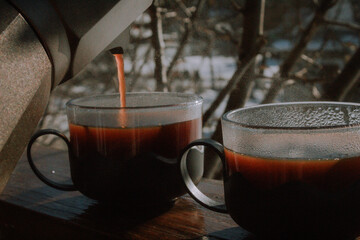 drink coffee from a geyser coffee maker in winter
