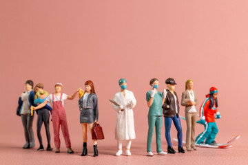 Obraz premium Miniature figurines of women representing diverse professions ,A perfect visual for International Women’s Day