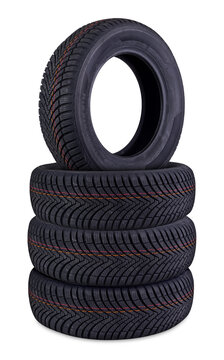stack of new mud and snow m+s all or four season tires isolated on white background highlighting their tread patterns and thickness. vehicle and car servicee change spare parts and industry concept.