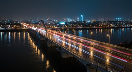Bridge at Night with Light Trails and City Skyline Background