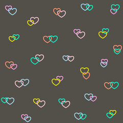 Neon hearts seamless pattern on a black background design create for Valentine's Day themes, greeting cards, wrapping paper, wallpapers, or fashion prints.