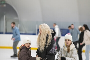 Portrait of a young beautiful mother and two young daughters.