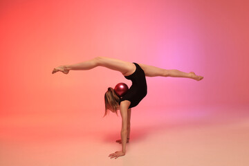 Naklejka premium Rhythmic gymnastics girl. Colourful background.