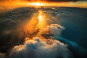 Fototapeta premium Aerial view of golden sunrise over ocean waves and clouds creating a serene landscape scenic beauty travel nature horizon vibrant sky panoramic.
