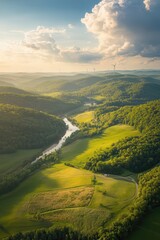 Aerial view of lush green landscape with river flowing through hills and fields under a cloudy sky, nature scenery, peaceful outdoors, travel destination.