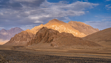 Colorful mountain landscape view in high altitude desert along Pamir Highway before sunset, Murghab, Gorno-Badakhshan, Tajikistan