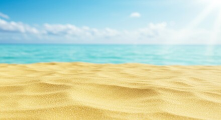 Obraz premium Golden sand texture meets blurred turquoise sea backdrop under soft daylight serenity