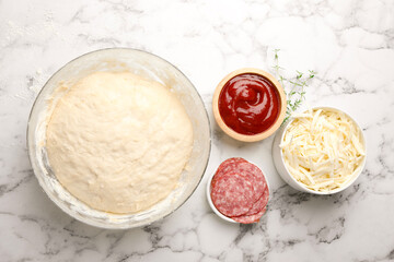 Making calzone pizza. Different ingredients on white marble table, flat lay