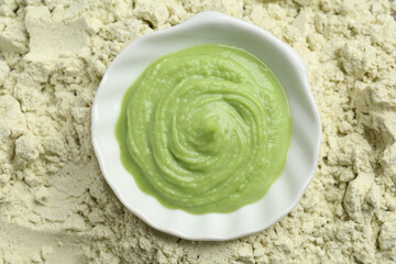 Bowl with wasabi paste on dry powder, top view