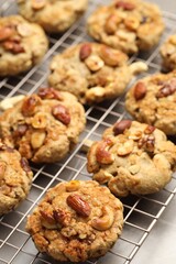 Tasty cookies with nuts on gray table, closeup