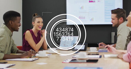 Image of data processing and diagrams over diverse colleagues discussing work