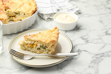 Piece of tasty homemade pie with chicken and vegetables on white marble table, closeup. Space for text