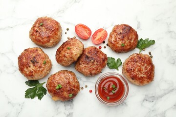 Delicious patties with sauce, cherry tomatoes, peppercorns and parsley on white marble table, flat lay