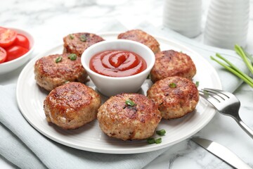 Delicious patties served on white table, closeup