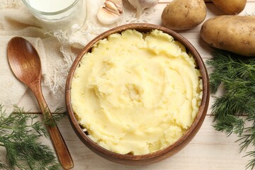 Delicious mashed potato on white wooden table, flat lay