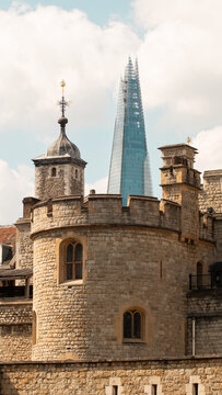 The Shard skyscraper and an old castle-like building in London