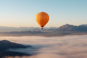 Obraz premium Hot Air Balloon Over Mountain Peaks and Foggy Valleys