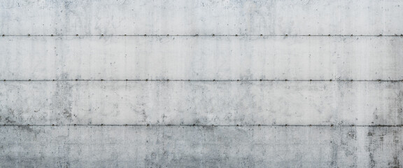 Industrial Wall Texture: A close-up captures the raw, weathered texture of a precast concrete wall, revealing the inherent beauty of industrial design and the passage of time.