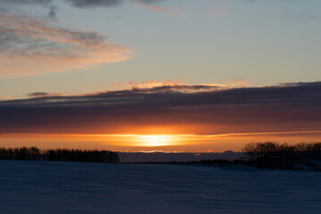 Sunrise over snow field in Hokkaido japan