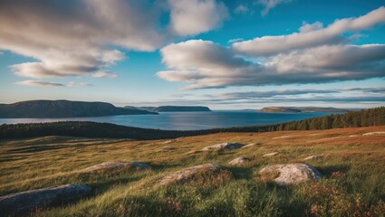 Landscape Views Over Still Waters Under Cloudy Skies And Lush Grasslands