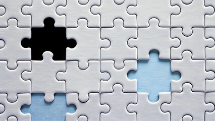 Fototapeta premium Close-Up of Interlocked White Jigsaw Puzzle Pieces with Contrasting Black and Blue Missing Sections, Symbolizing Problem-Solving and Strategy