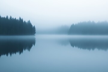 Fototapeta premium Serene Misty Lake Surrounded by Pine Trees at Dawn