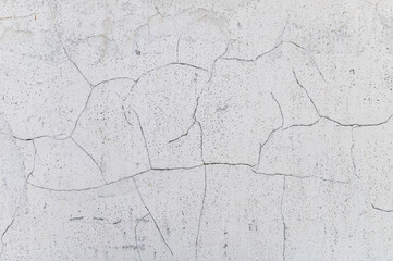Light cracked wall. Minimalistic soft wall texture with cracked details.