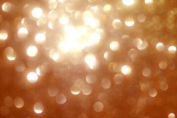 Soft golden lights shimmer in the background, creating a festive ambiance. The blurred effect adds...