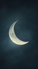 Serene Crescent Moon Illuminating Night Sky with Soft Clouds