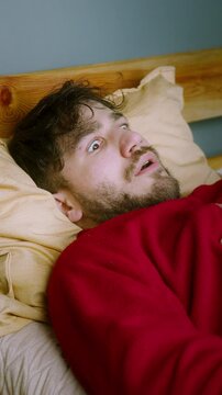 Man Waking Up in Shock After a Nightmare &ndash; Sleep Paralysis or Sleep Apnea Reaction ,vertical video