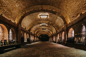 Obraz premium Khareba Winery’s tunnel in Kvareli, Kakheti (Georgia), is a 7.7 km underground wine cellar carved into rock, maintaining perfect aging conditions.